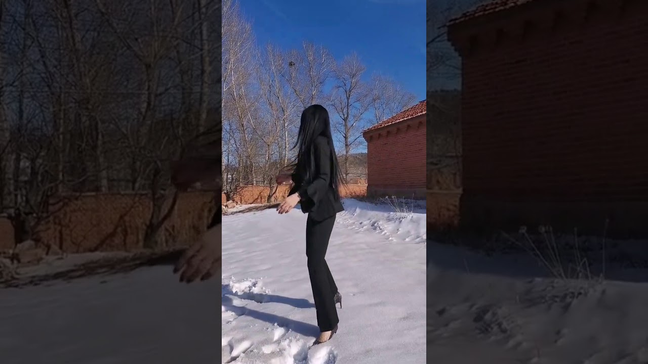 Beautiful girl in sexy high heels walking on the snow