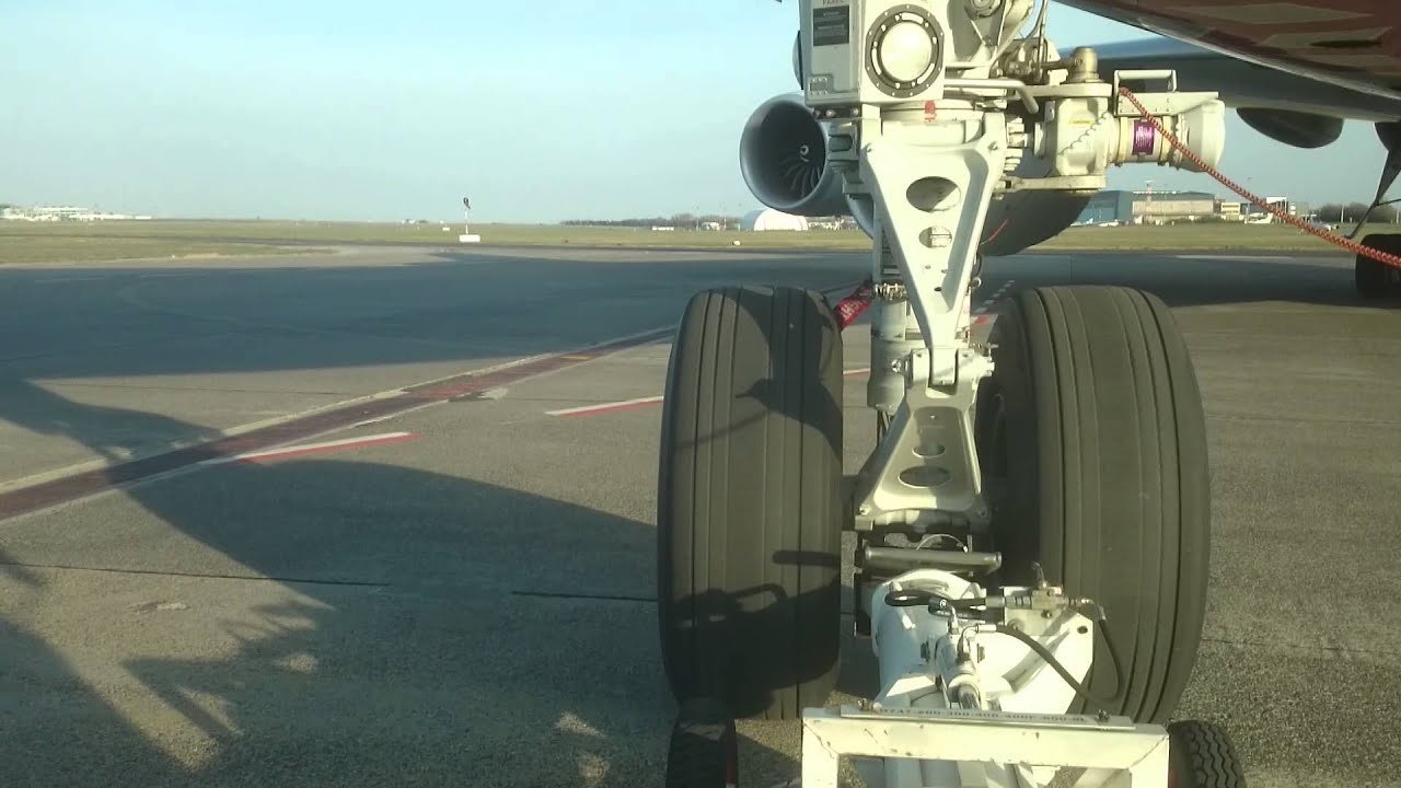 Boeing 747-800 push back with towbar tractor