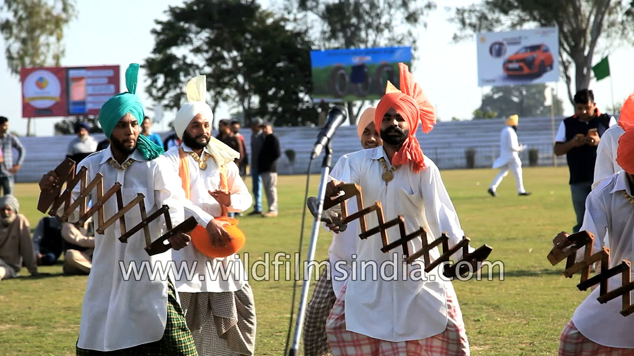 Punjabi men perform Bhangra at Kila Raipur sports festival 2018