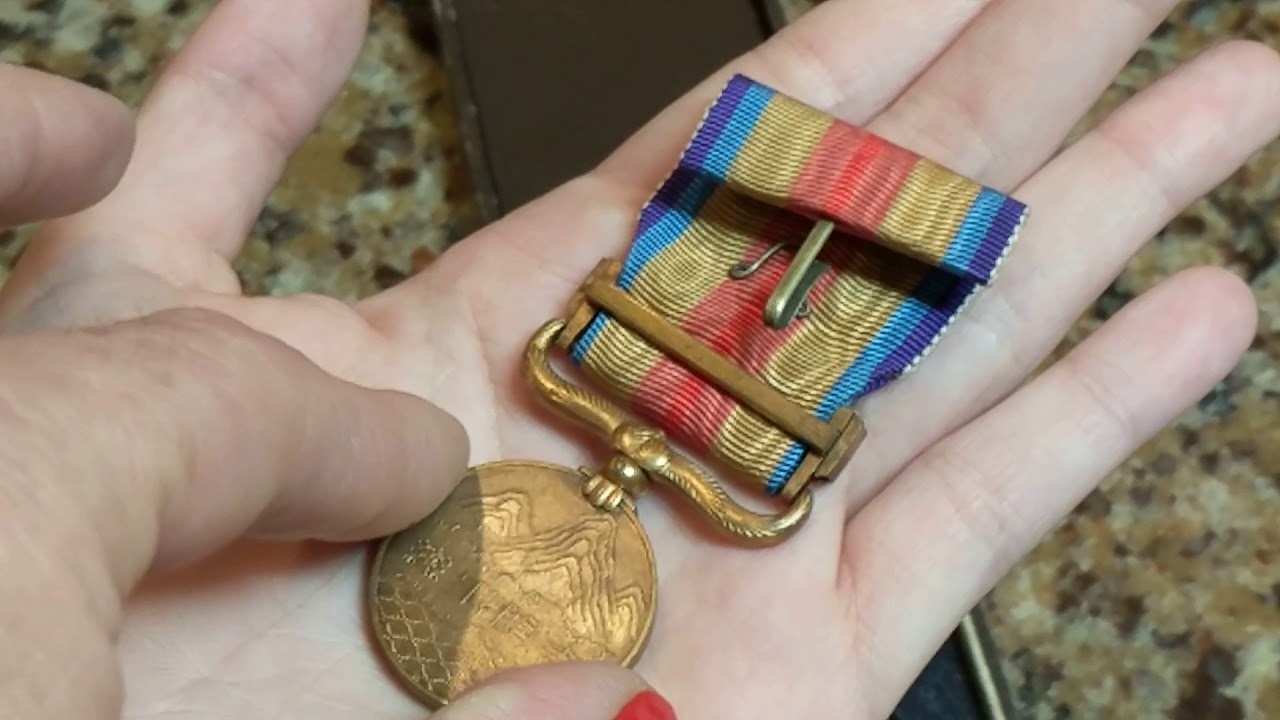 My Daughter Showing Her WWII Military Medal Collection