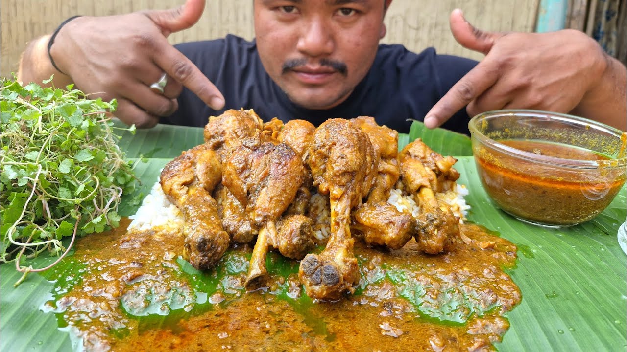 EATING SPICY CHICKEN CURRY AND RICE 