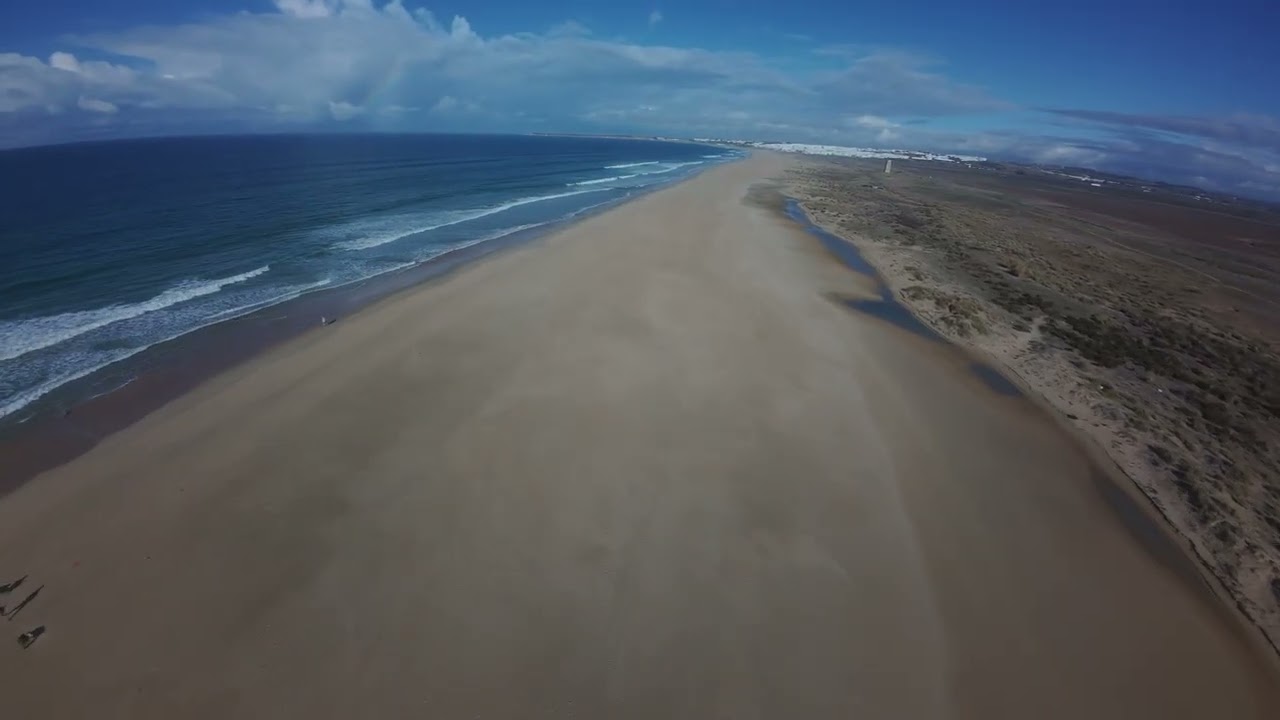 Cinematic FPV drone flight on the beach. El Palmar, Conil, Vejer de la Frontera, Cádiz, Spain.