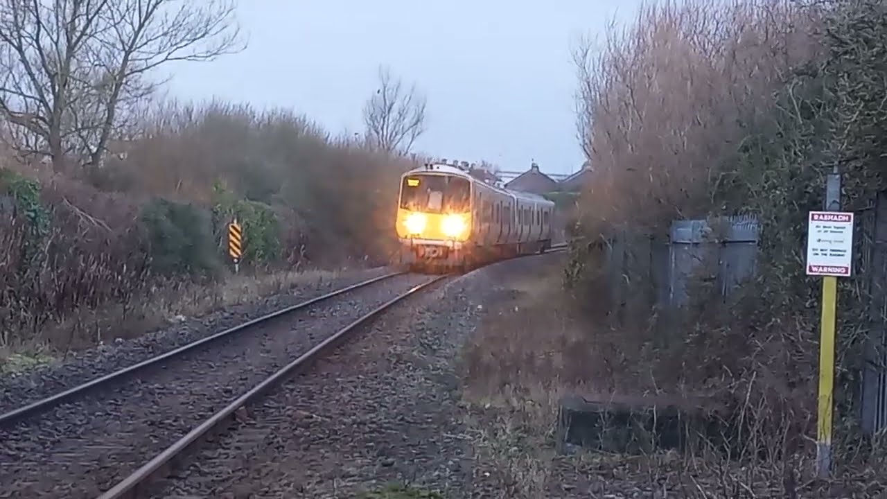 13.45 Galway-Limerick train at Long Pavement Level Crossing in Limerick City on 17.1.2023