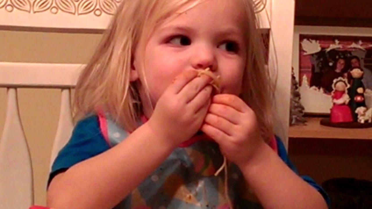 Kids eating spaghetti