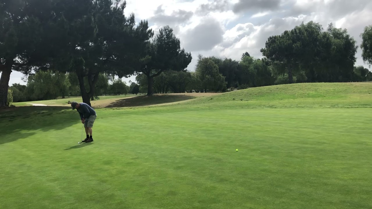 Amateur golfer wearing jack Nicklaus’s old shoes and very high black socks!