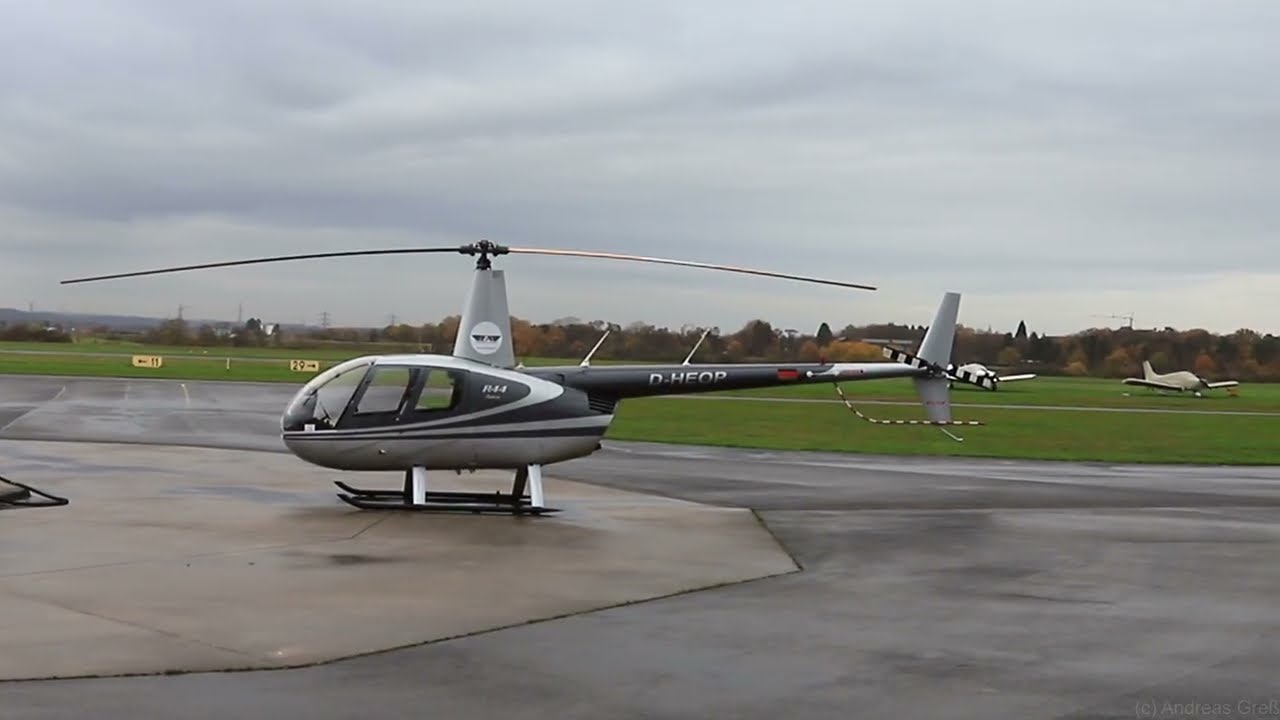 R44 D-HEOP departing at the station.