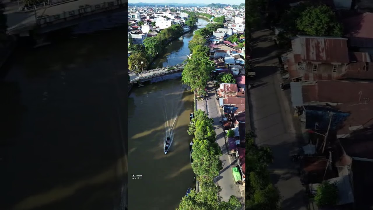 small boat on the river in the middle of the city #ship