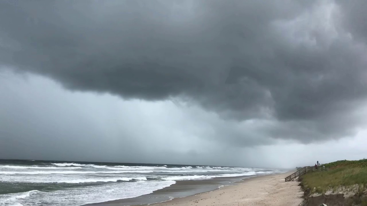 PEOPLE SWIMMING with Category 5 Hurricane Dorian 120 miles away!