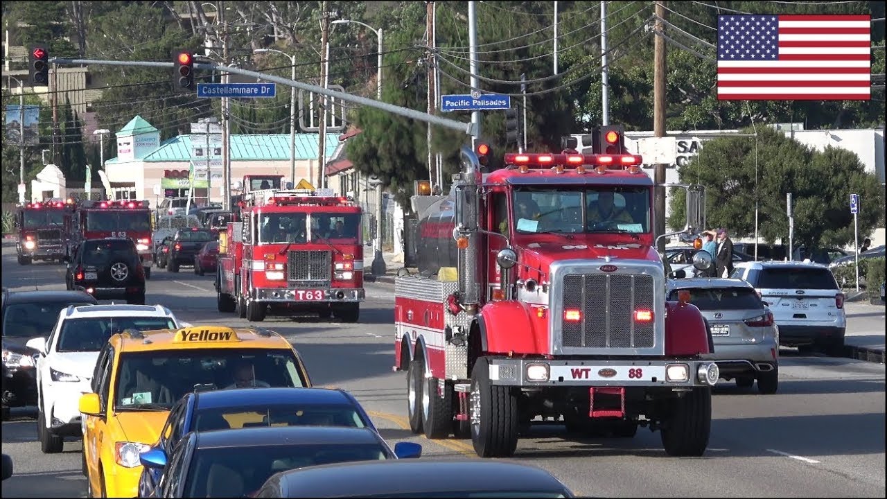 Huge convoys of fire trucks responding blasting horn and siren