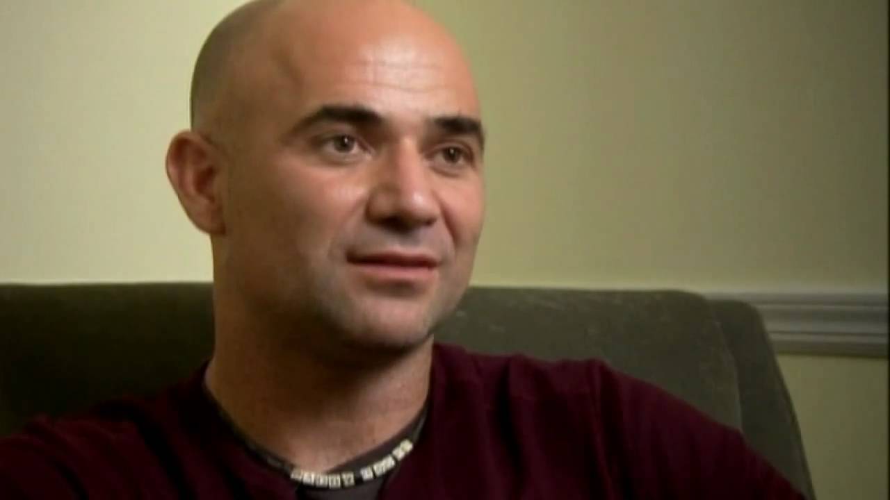 Andre Agassi signs copies of autobiography ' Open' for fans