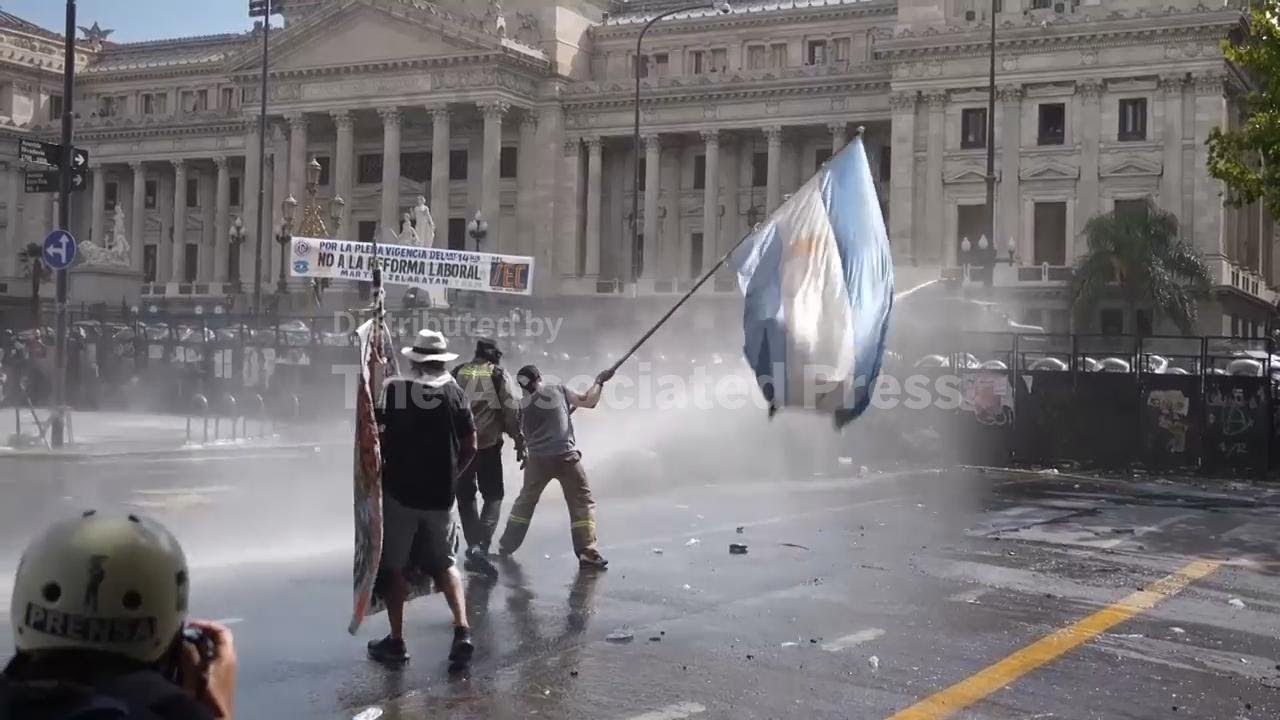 Tear gas and water cannon used to disperse protesters as Argentine senators debate labor laws reform