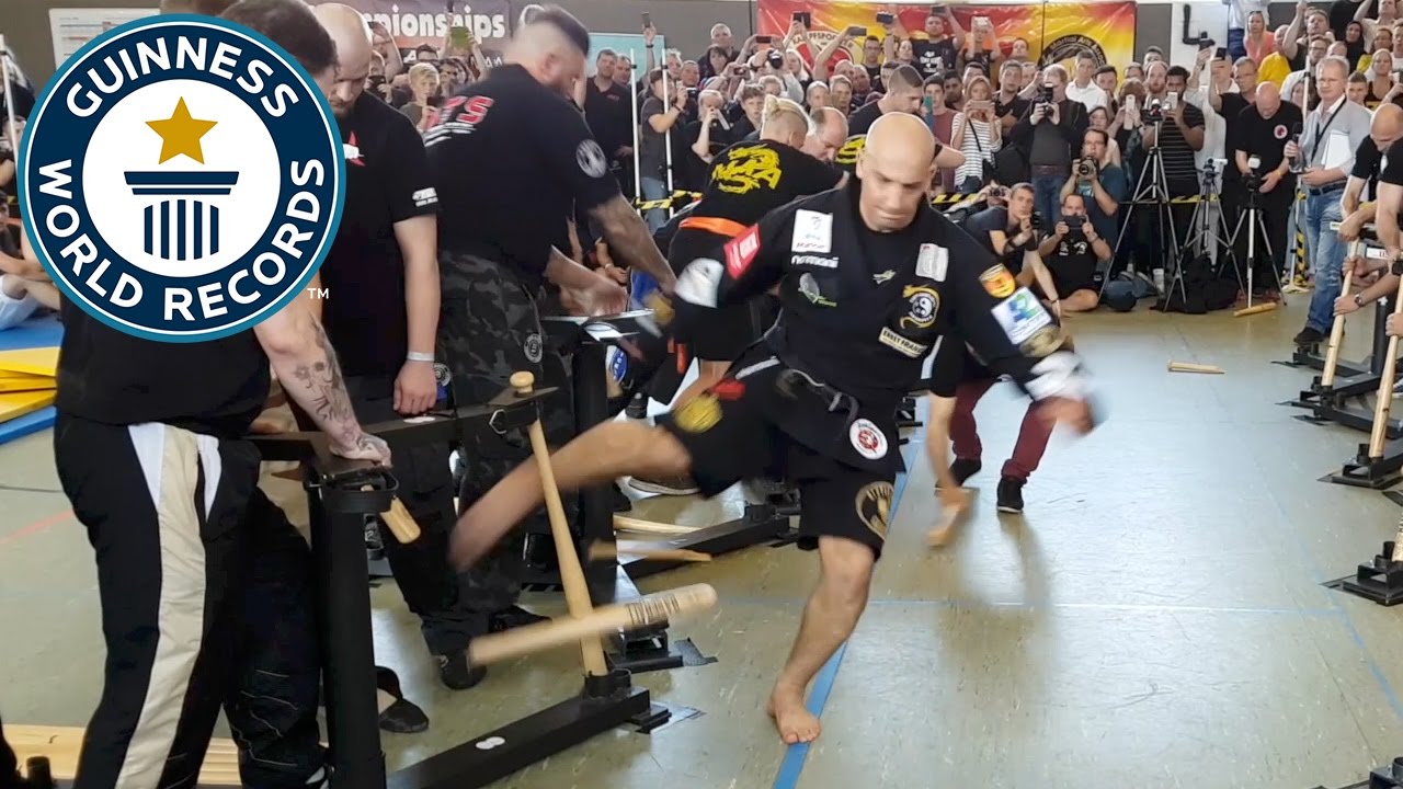 Most baseball bats broken with shins in one minute - Guinness World Records