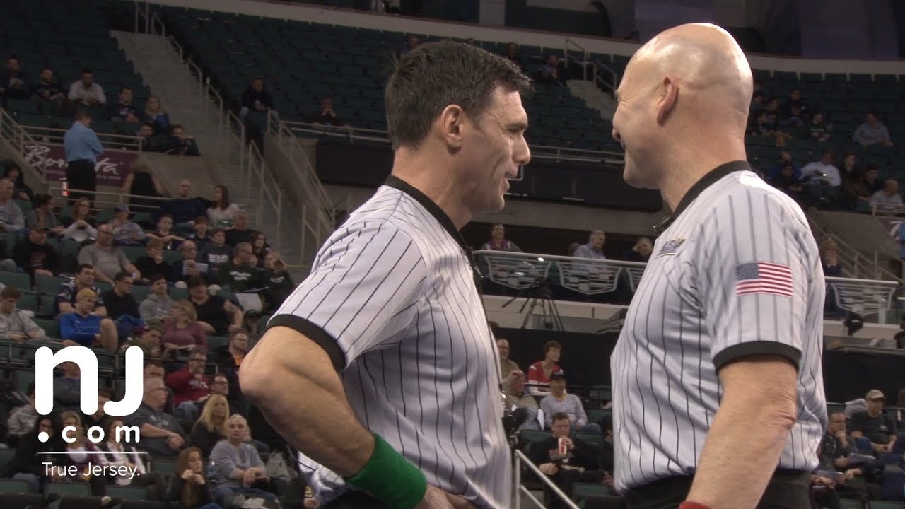 Beyond whistles: Watch 2 mic’d wrestling refs in action at the State Championships