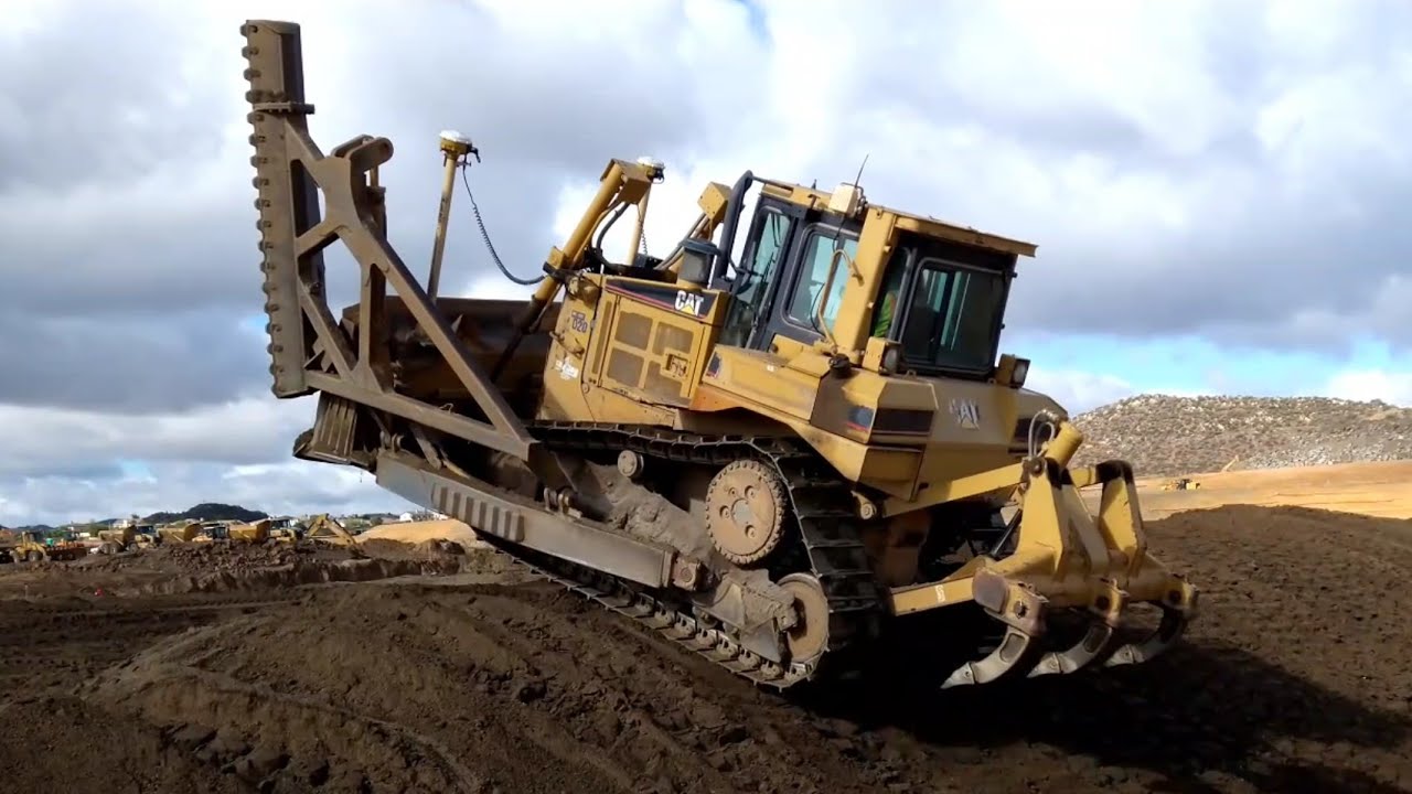 CAT D6R Dozer cutting back/ compacting slope