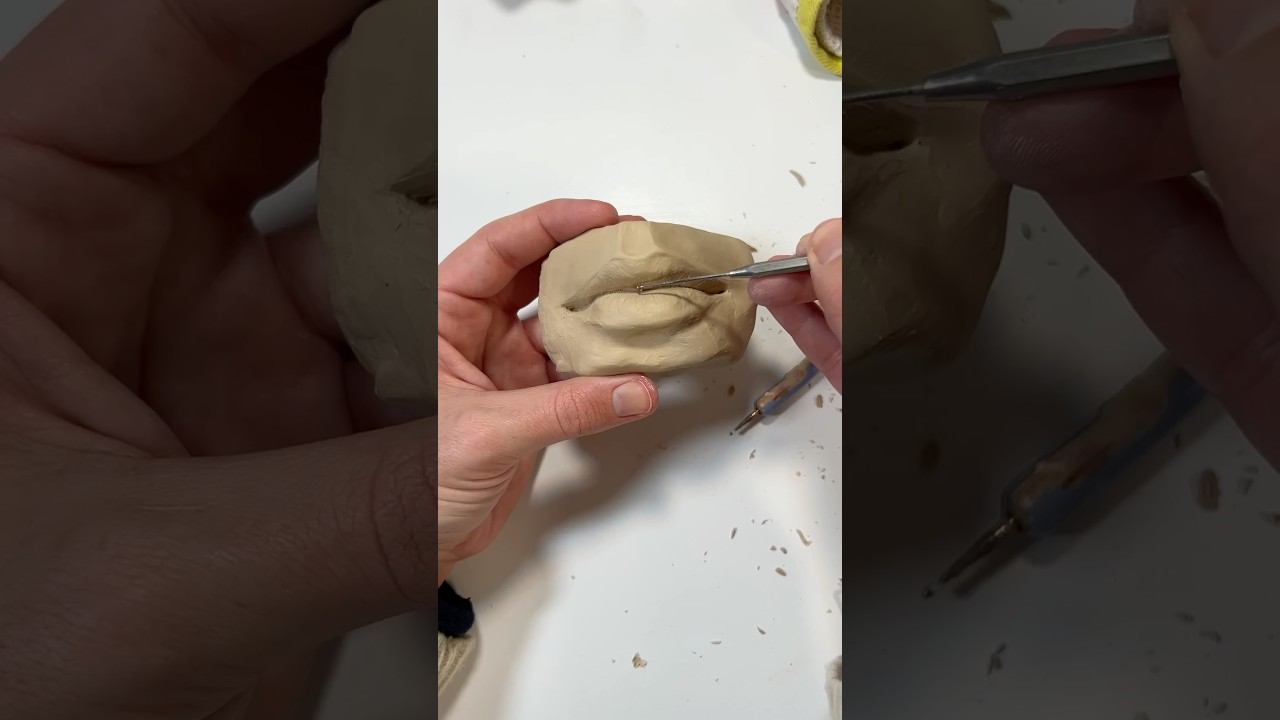 Sculpting the mouth 👄 #ceramics #sculpture (reference book by @anatomy4sculptors ❣️)