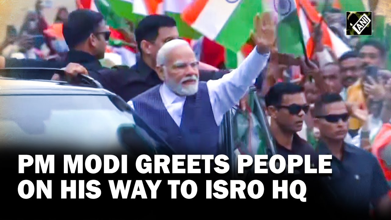 PM Modi greets people on his way to ISRO Mission Control Complex in Bengaluru to meet Scientists