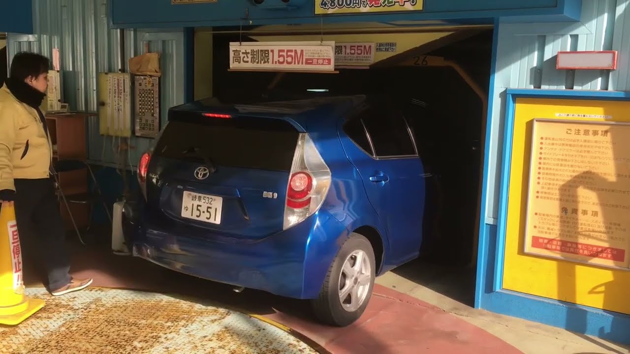 Parking cars in an automatic parking tower in Japan. Elevator parking tower for your car. Nagoya.