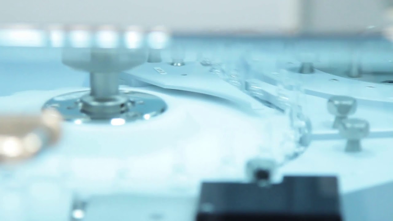medical ampoules on conveyor line close up of medical vials on pharmaceutical production