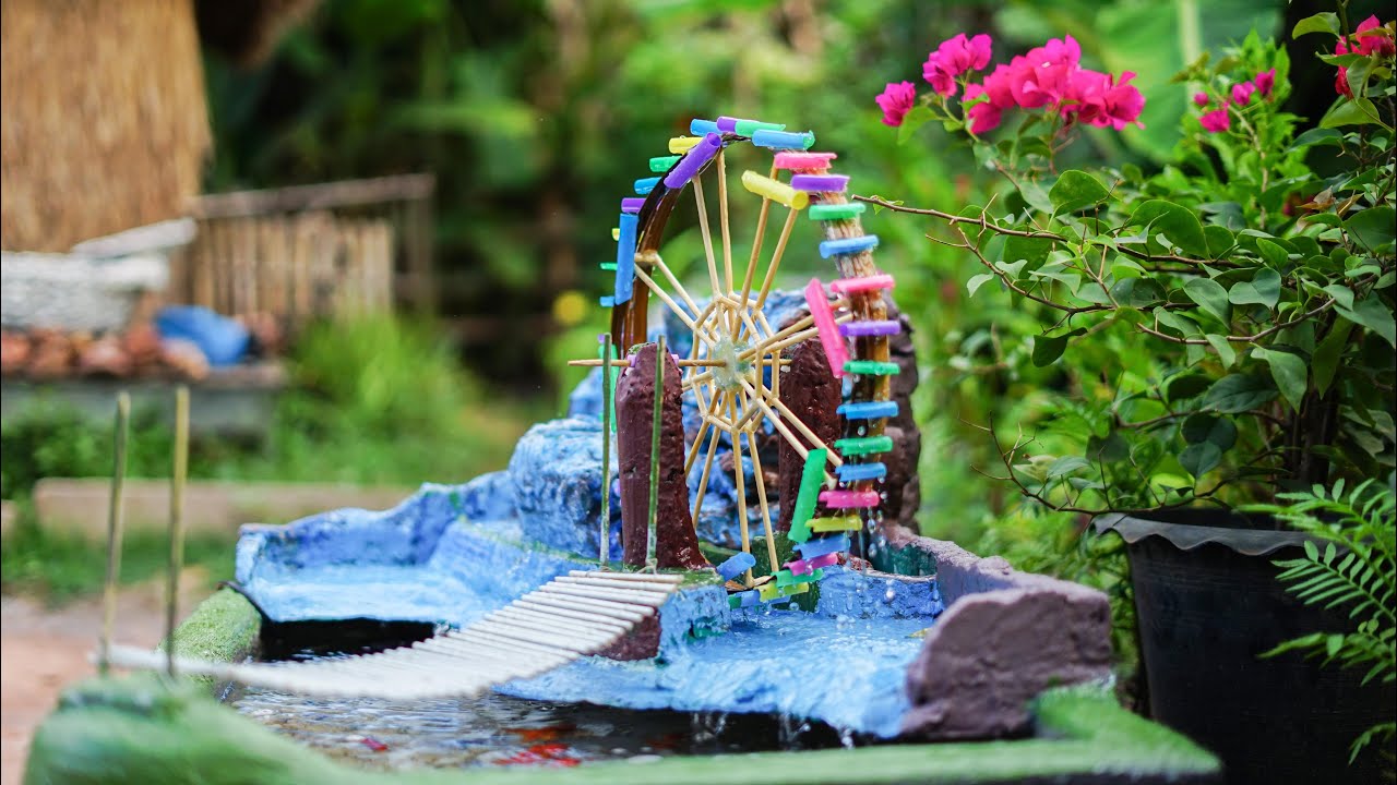 Beautiful waterwheel fountain aquarium which is made from cements chopstick and plastic straw