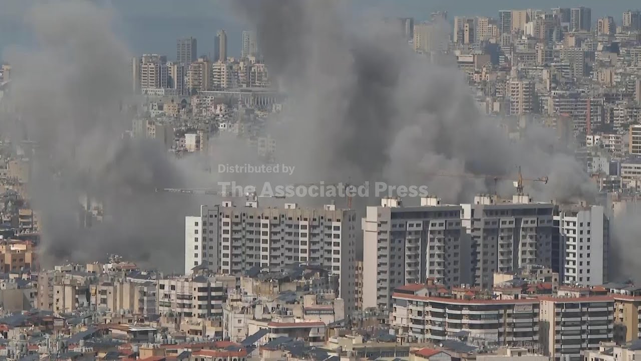 Explosion and plumes of smoke rising in Beirut following Israeli strike