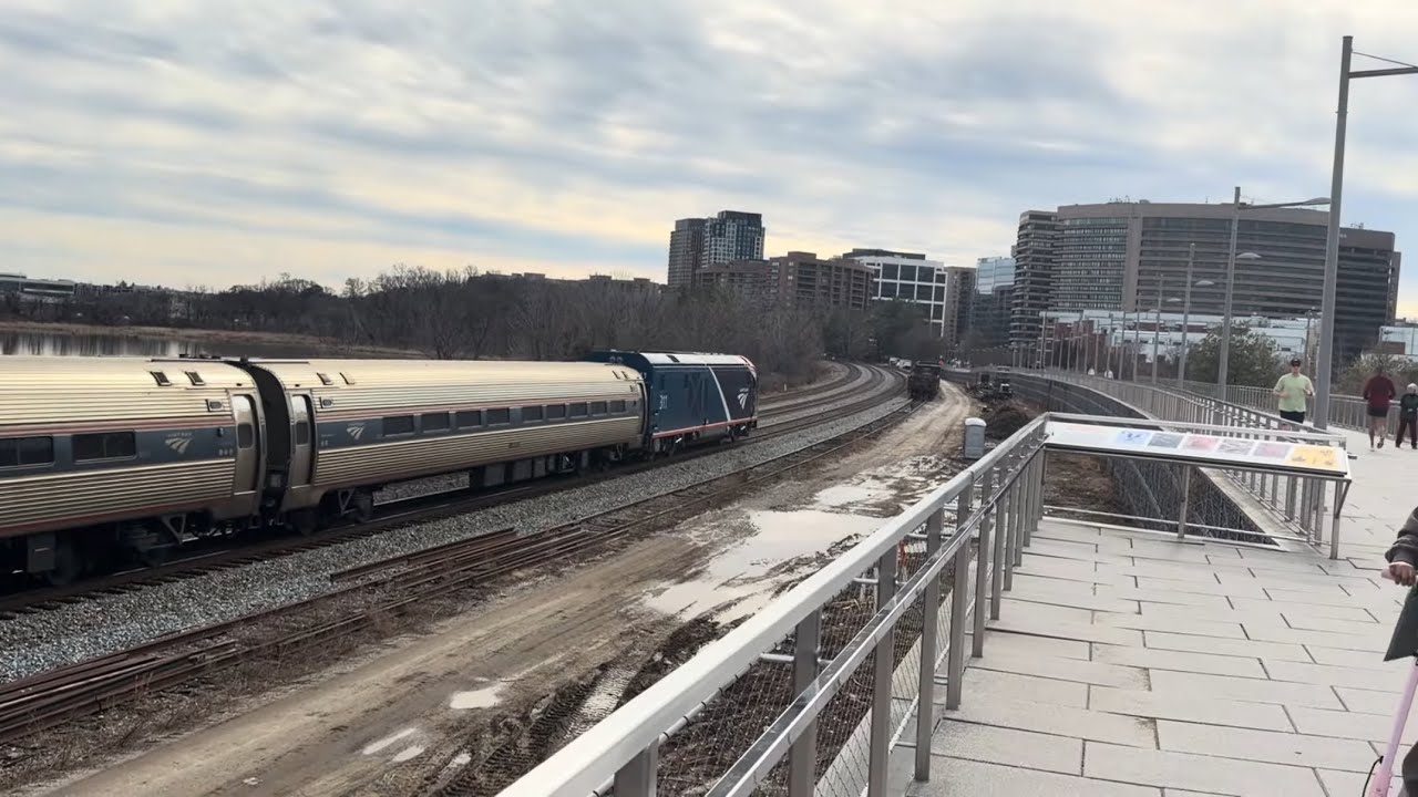 AMTK 311 leads the Northeast Regional at Long bridge park Arlington Virginia.