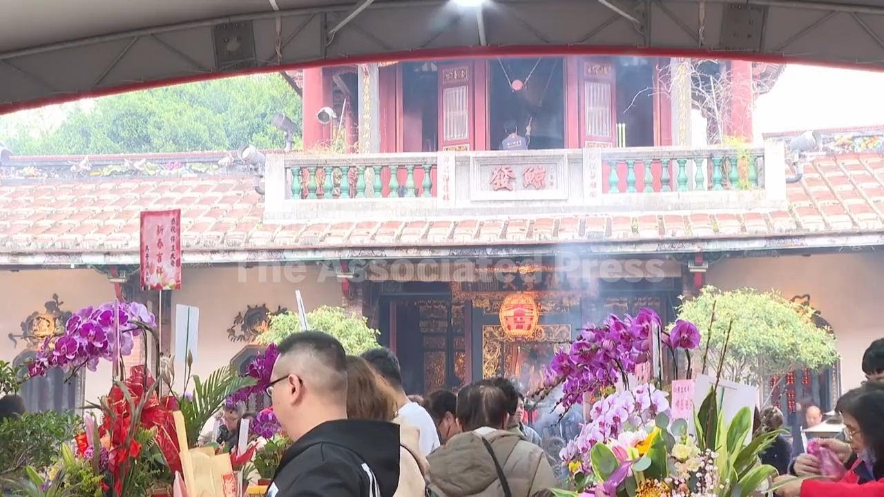 Taipei temple strikes its bell 108 times to welcome the Year of the Horse