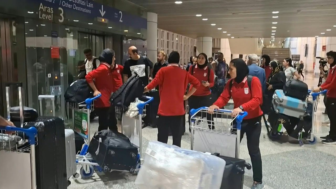 Iranian women footballers begin journey home as teammates claim asylum in Australia | AFP