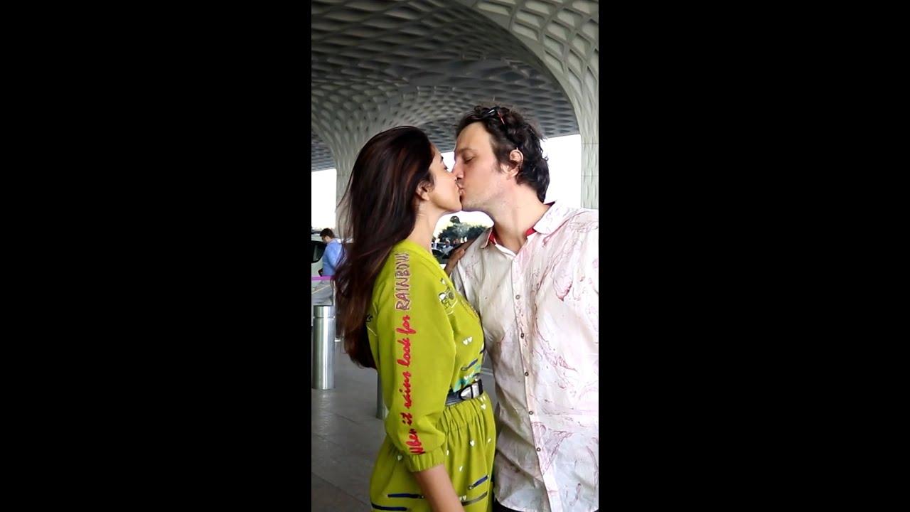 'All you need is love'- Shriya Saran's husband gives her a kiss at the airport