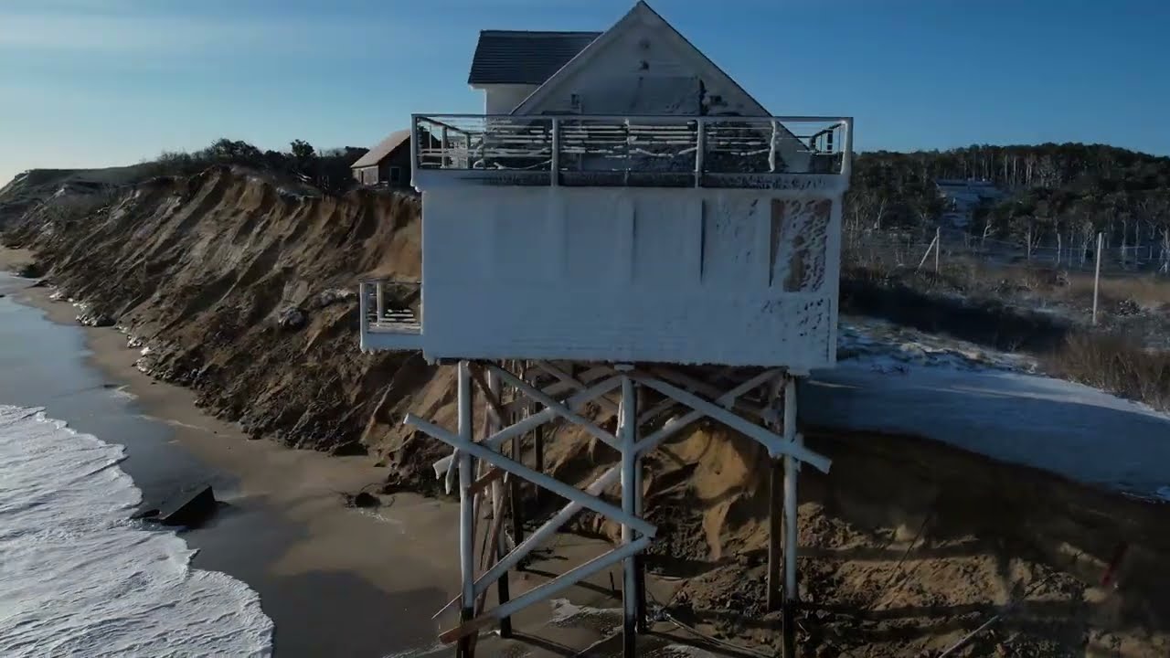Drone of house nearly falling into the Ocean at Truro, Massachusetts after bomb cyclone