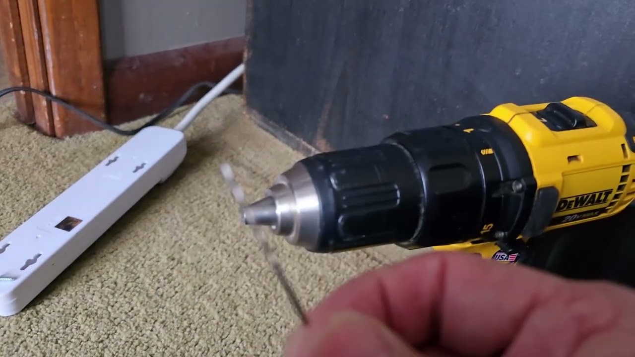 Mounting a power strip on the side of a cabinet.