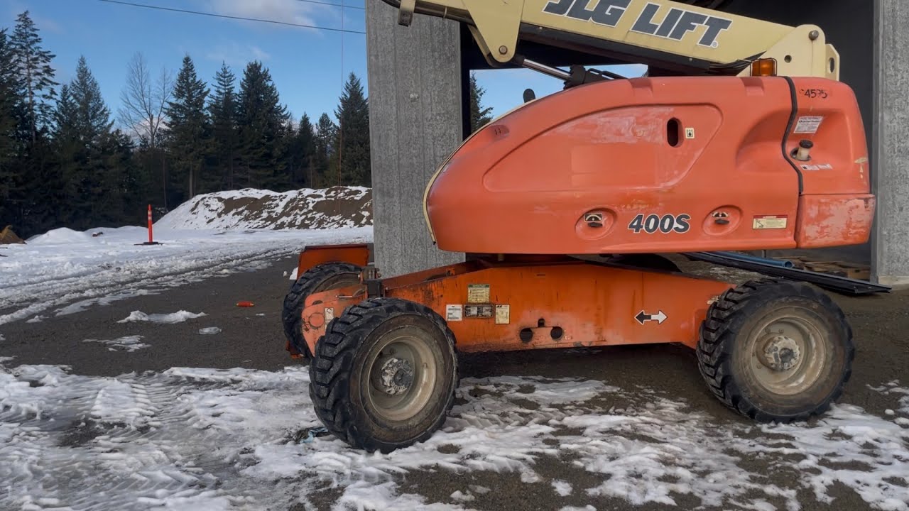 Repairing a JLG 400S manlift with multiple oil leaks