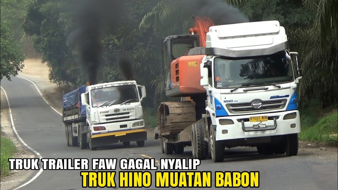 TRUK TRAILER HINO MUATAN EXCAVATOR NANJAK SANTAI DI SALIP TRUK FAW MALAH KETENGGAK