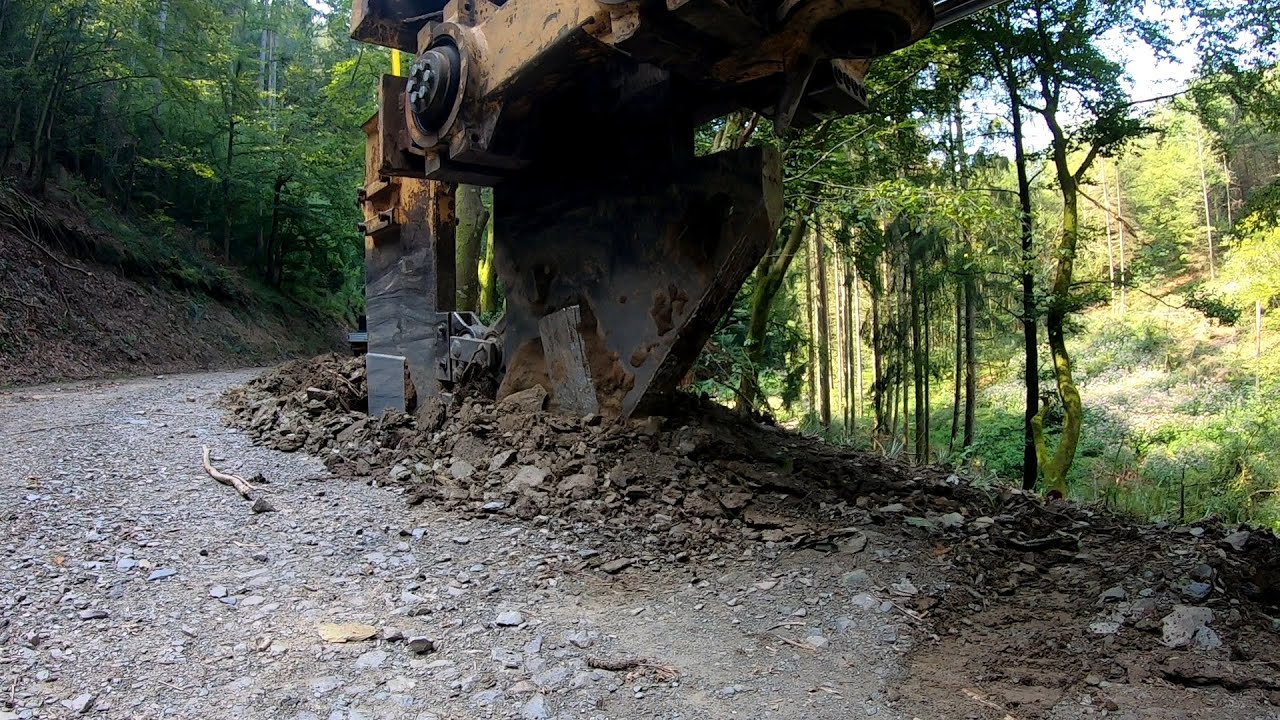 Plowing Pipe in a trench through the forest