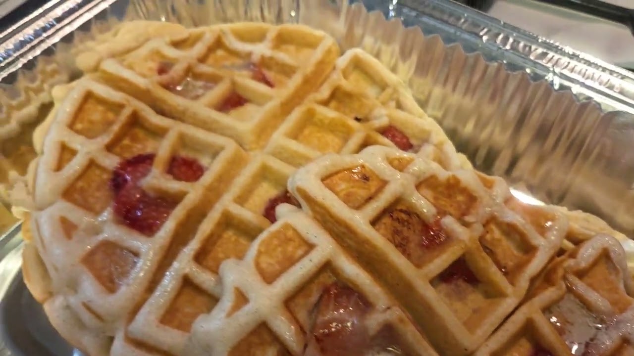 Chicken, strawberry waffles and smothered potatoes with onions, bell peppers and cheese. 