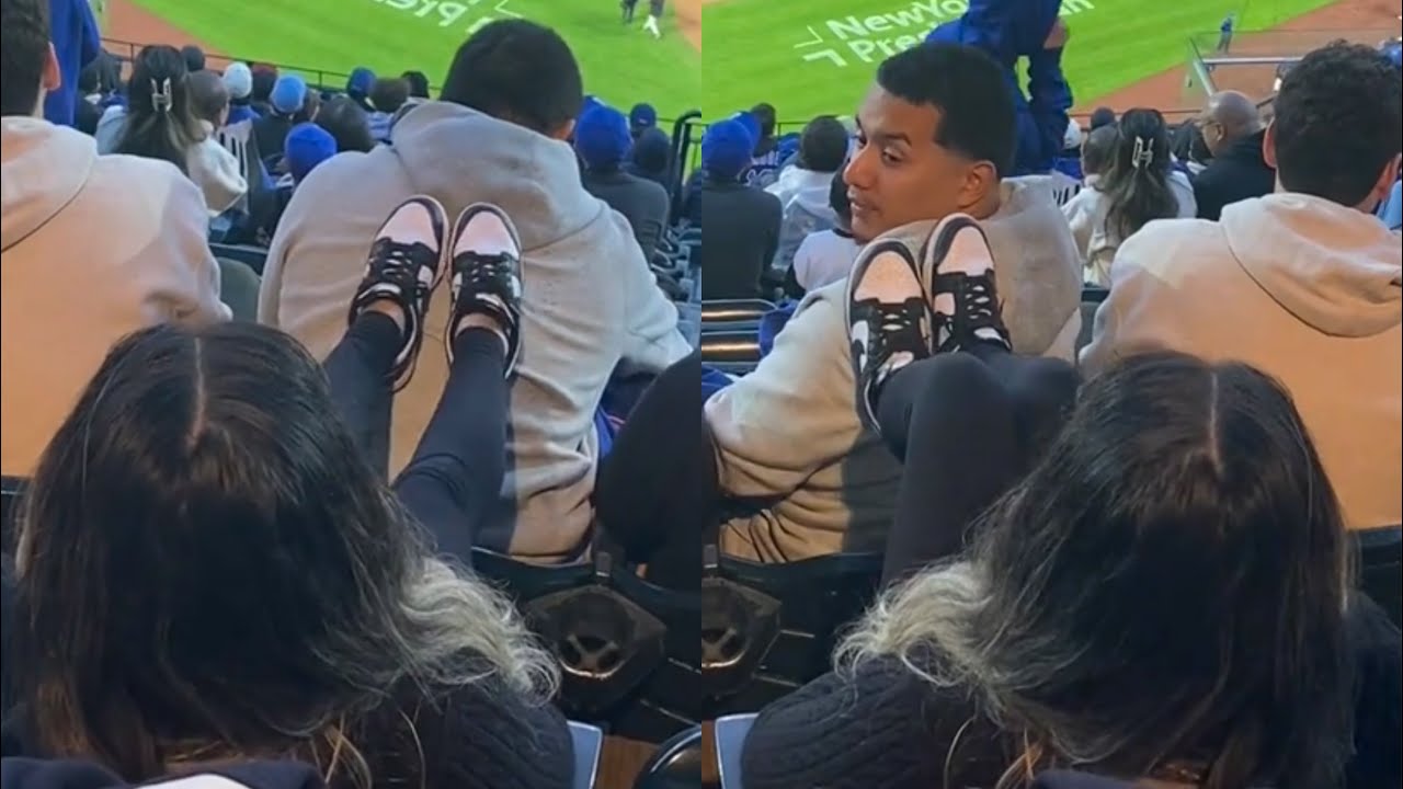 Woman Gets KICKED OUT Of Stadium For Putting Her Feet On Man’s Back 