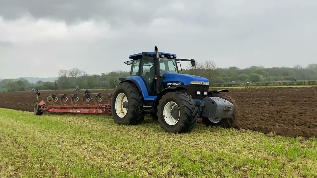 New Holland 8970A ploughing with 6 furrow semi mounted plough