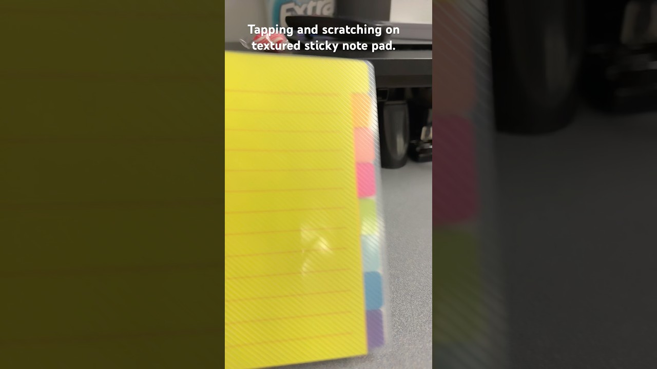 Tapping and scratching on textured sticky note pad thing. 