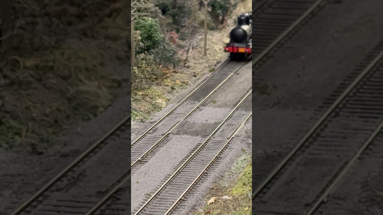 War Department #101 heads through a non gated level crossing running light