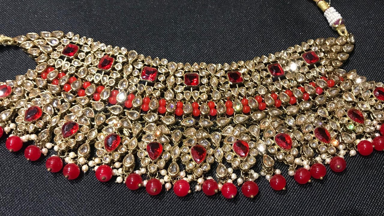 Red wedding jewellery original reverse ad @10300/-