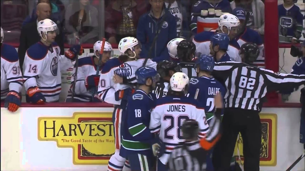 Zack Kassian mocks Sam Gagner's face shield