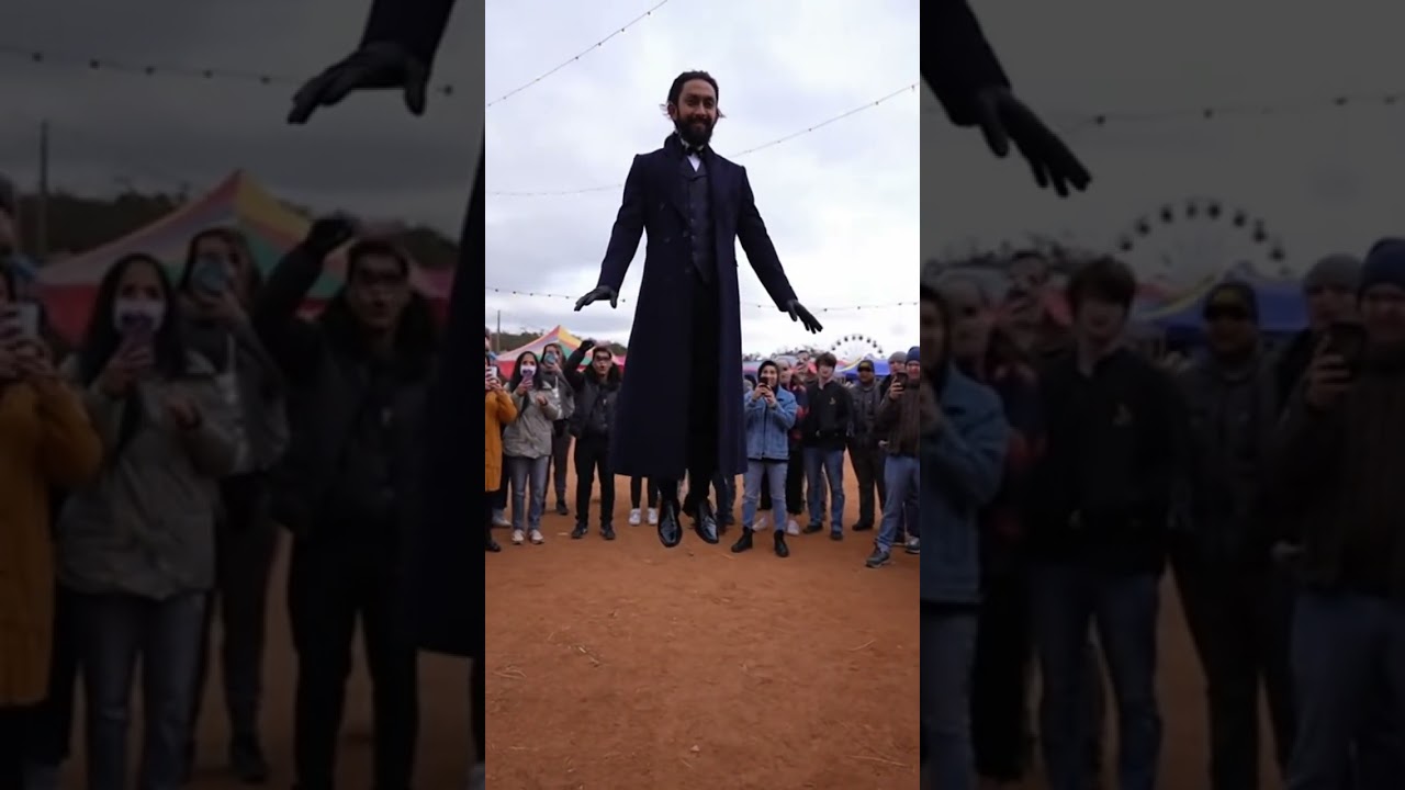 Can you find him? 😊 magician in an open circus arena levitates above the ground while people