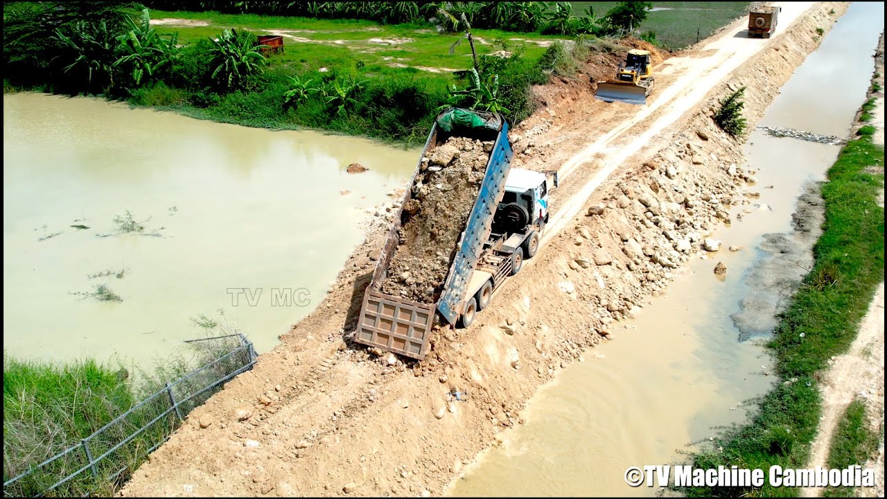 Excellent processing connecting village road | Dozer and truck spreading stone making new road