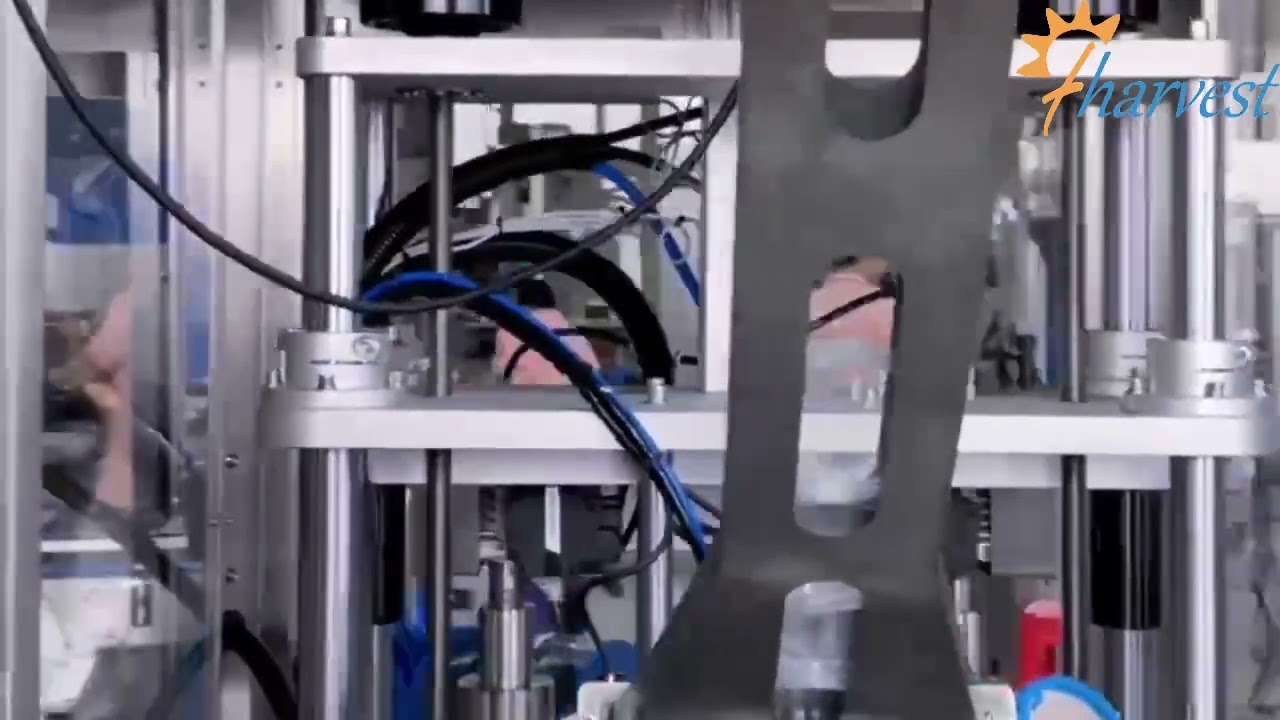Plastikozko txapelak altxatzeko makina,buru bikoitzeko plastikozko estalkietarako makina automatikoa