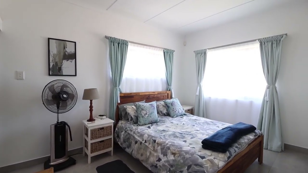 Immaculate and elevated home with uninterrupted Mountain and sea views.