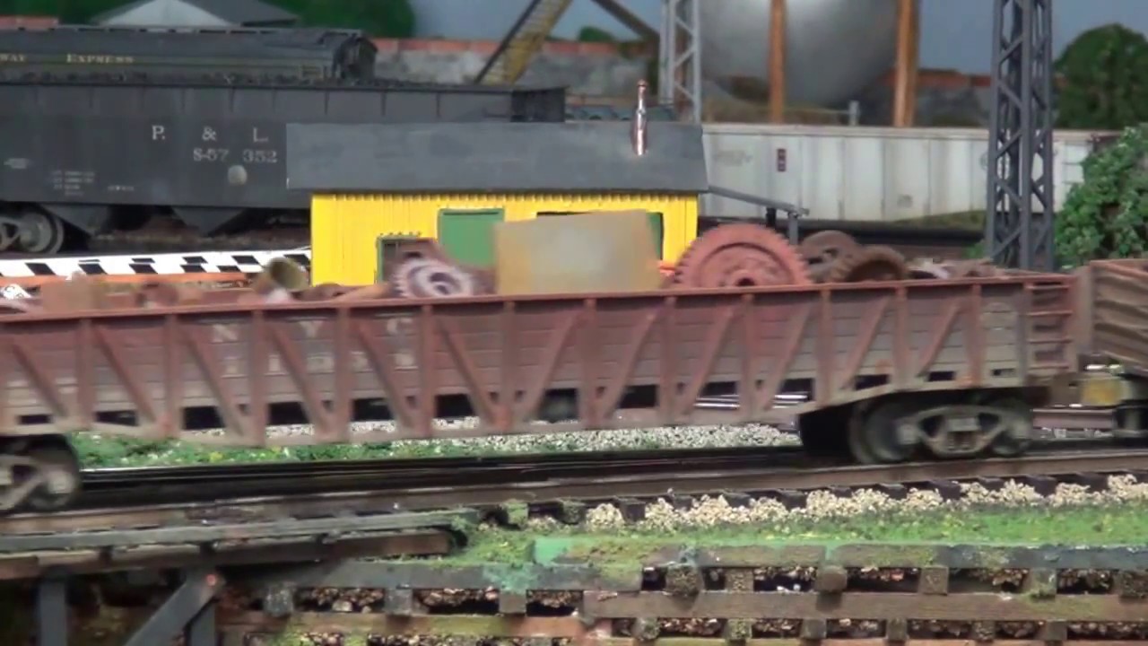 0-8-0 scrap train passing through town