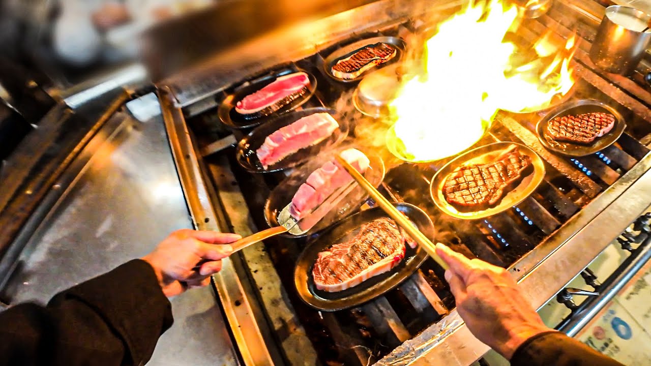 POV: Steak Chef Grilling Steak On a Hot Iron Plate