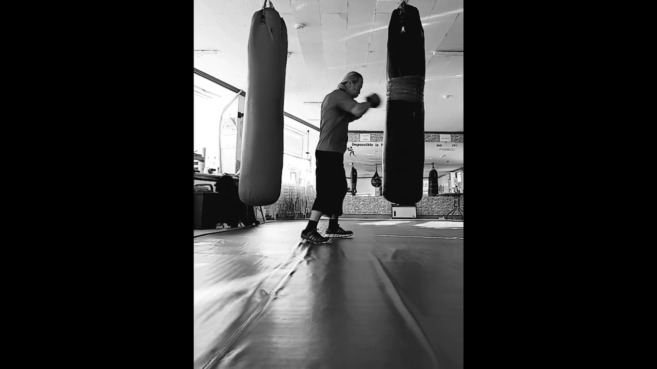 practicing how to hit the sandbag 