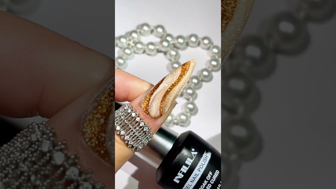 Gold Ribbon Nail Art ✨🎀Delicate gold ribbon details over a glossy base. #infilila #nails #nailart
