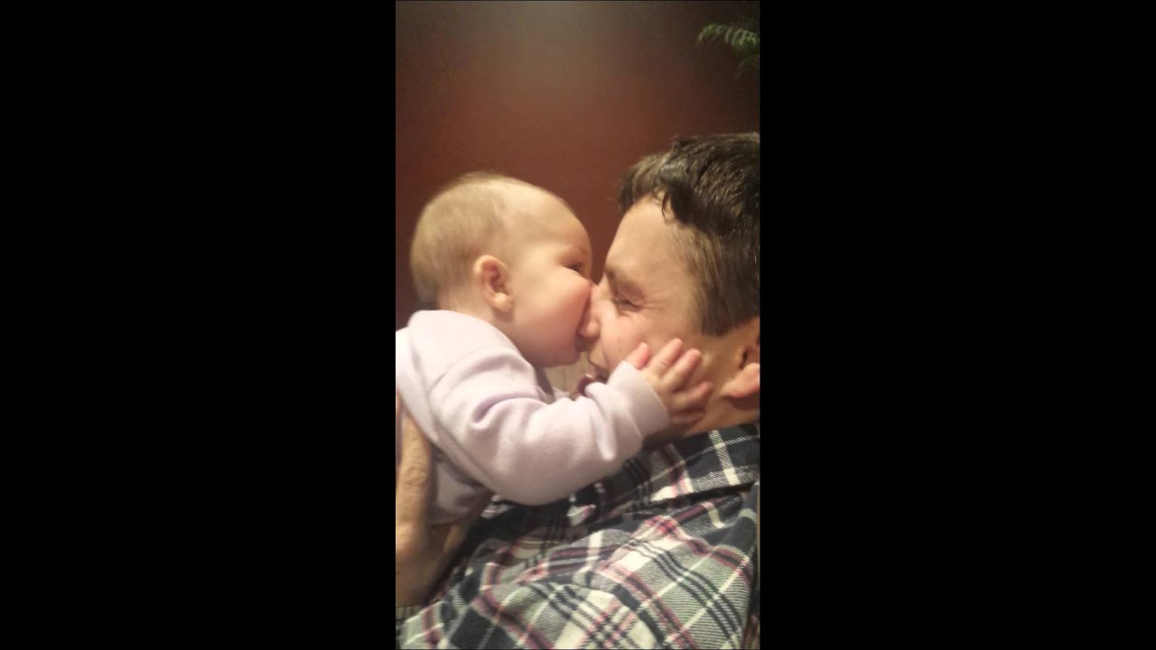 Baby eats dads face