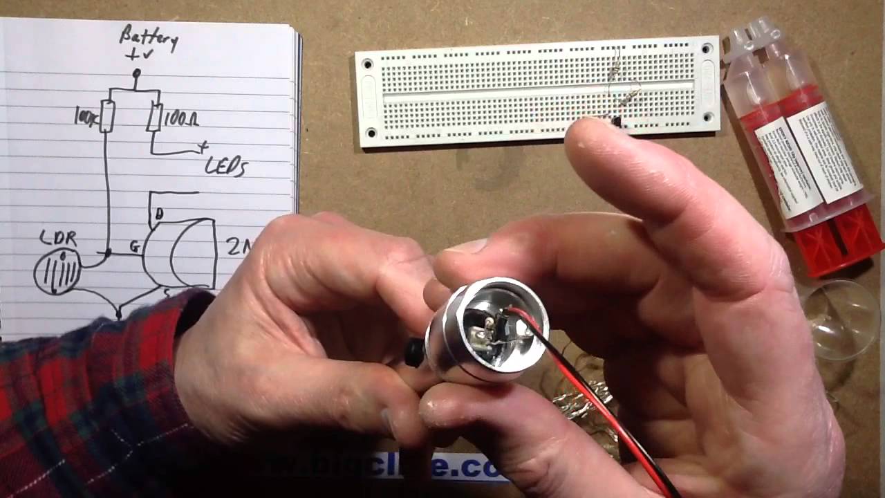 Potting electronics into a flashlight case with resin.
